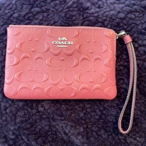 Pink Coach corner zip wristlet